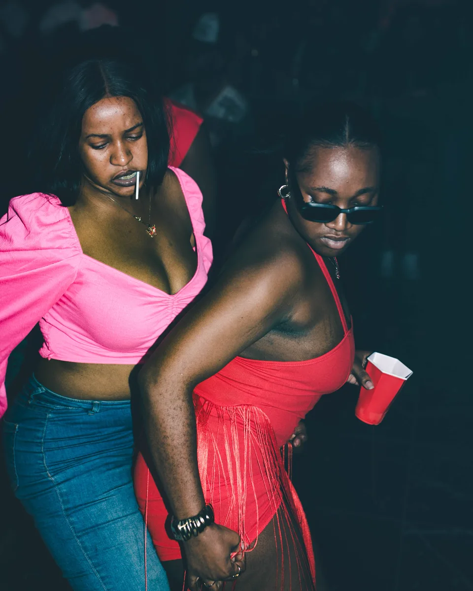 Two G+ guests dancing, one wearing blue jeans and a pink top